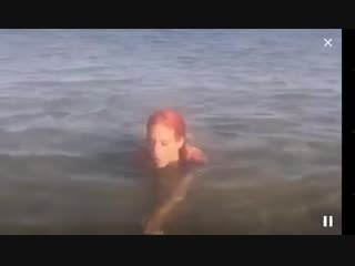 girl in a bikini on the beach in cam