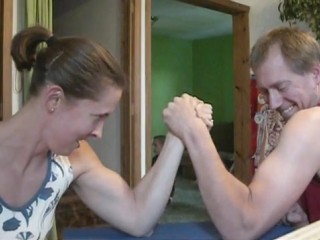 husband and wife hand wrestling